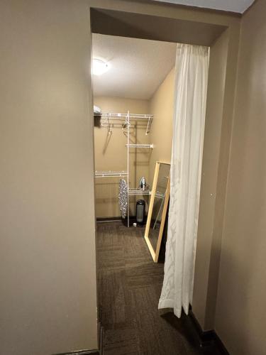 a hallway of a room with a shower and a curtain at Peaceful House with Backyard in Langley