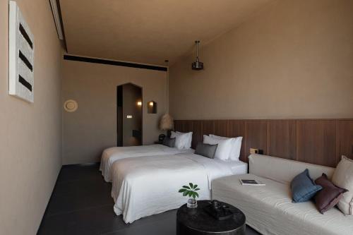 Ένα ή περισσότερα κρεβάτια σε δωμάτιο στο zhangjiajie national park Oxgen Resort