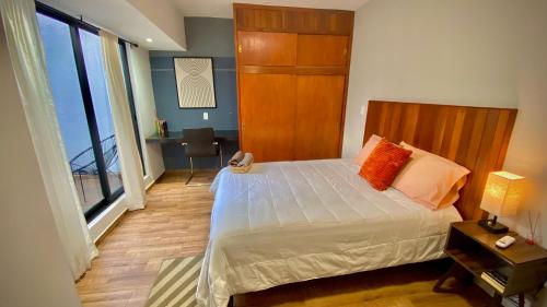 Ένα ή περισσότερα κρεβάτια σε δωμάτιο στο Departamento Maderas