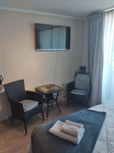 Ένα ή περισσότερα κρεβάτια σε δωμάτιο στο Departamentos Pehumayen