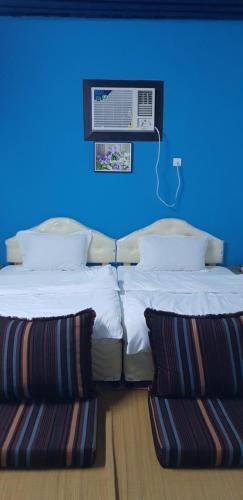 Ліжко або ліжка в номері Tiwi Santorini