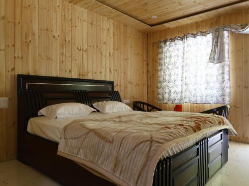 Postel nebo postele na pokoji v ubytování Siddhi Vinayak Residency By StayApart