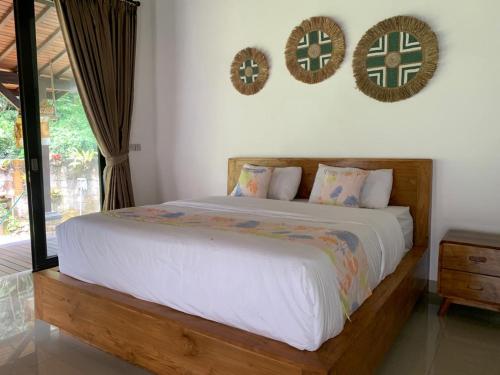 Ένα ή περισσότερα κρεβάτια σε δωμάτιο στο Omah Jegeg