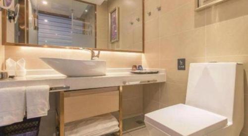 a bathroom with a sink and a toilet at Lavande Hotels· Suizhou Wenfeng in Suizhou