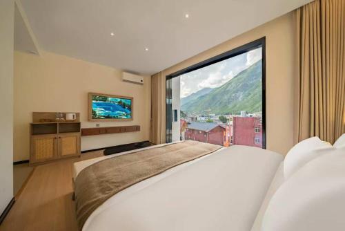 Ένα ή περισσότερα κρεβάτια σε δωμάτιο στο Wild Twilight Mountain Homestay