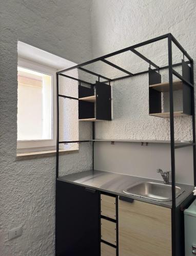 Kuchyň nebo kuchyňský kout v ubytování SAGARESE Sleep & Dreams