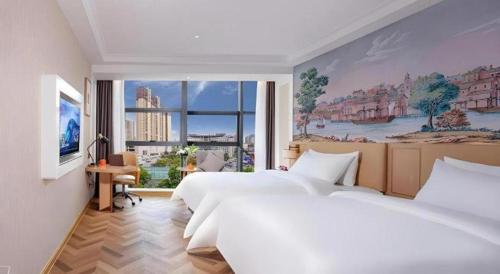 Ένα ή περισσότερα κρεβάτια σε δωμάτιο στο Vienna Hotel Guiyang Yunyan District Government