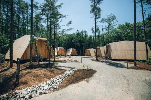a group of tents in the middle of a forest at SANU 2nd Home 河口湖1st in Fujikawaguchiko
