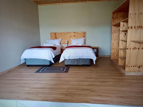 Postel nebo postele na pokoji v ubytování Tsoelike River Lodge