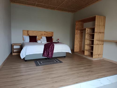 Ένα ή περισσότερα κρεβάτια σε δωμάτιο στο Tsoelike River Lodge