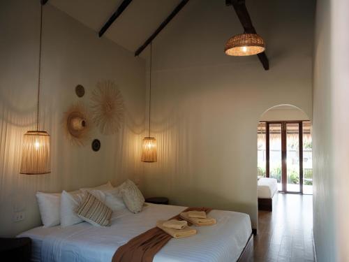 Ένα ή περισσότερα κρεβάτια σε δωμάτιο στο Sunstone Koh Chang