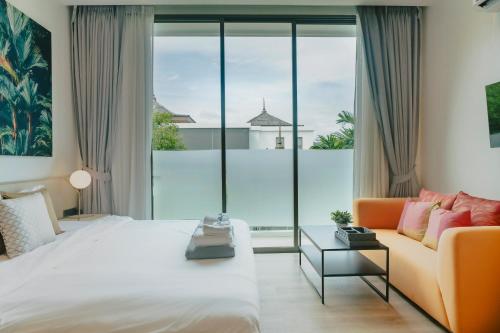 Ένα ή περισσότερα κρεβάτια σε δωμάτιο στο Teak 5 Bedroom Luxurious Pool Villa Bangtao Beach