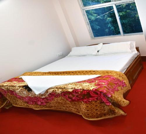 Ένα ή περισσότερα κρεβάτια σε δωμάτιο στο Nigaah Homestay By StayApart