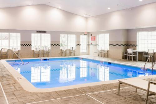 a large swimming pool in a hotel room at Country Inn & Suites by Radisson, Winchester, VA in Winchester