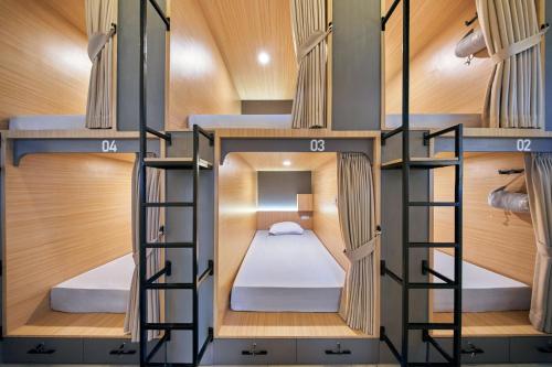 Postel nebo postele na pokoji v ubytování Sky Sleepbox