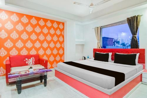 Un pat sau paturi într-o cameră la Super Collection O City Center New Town Kolkata Formerly Paradise Inn