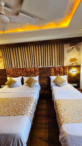 Postel nebo postele na pokoji v ubytování Hotel Lotus Lide