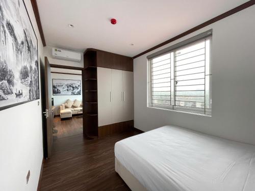 Ένα ή περισσότερα κρεβάτια σε δωμάτιο στο Khách sạn Hải An Quế Võ