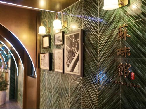 a room with a wall with green and white tiles at Habo Hotel Shanghai, a member of Design Hotels in Shanghai