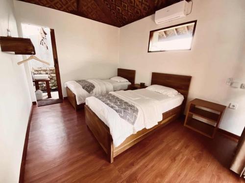 Ένα ή περισσότερα κρεβάτια σε δωμάτιο στο Banana surf and stay