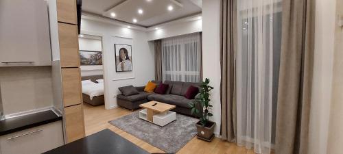 Χώρος καθιστικού στο Extra Apartman