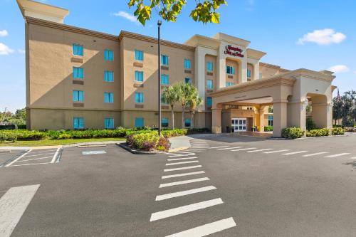 a rendering of a hotel with a parking lot at Hampton Inn & Suites Port Richey in Port Richey