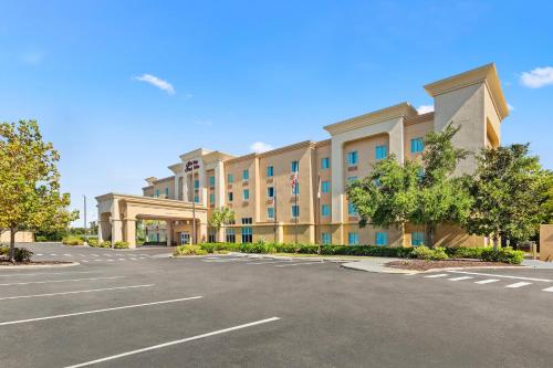 an empty parking lot in front of a building at Hampton Inn & Suites Port Richey in Port Richey