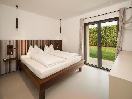 Ένα ή περισσότερα κρεβάτια σε δωμάτιο στο Lagolino Boutiquehouse