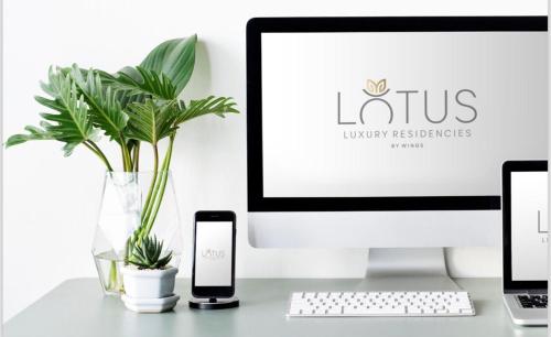 Et logo, certifikat, skilt eller en pris der bliver vist frem på Lotus Luxury Residencies