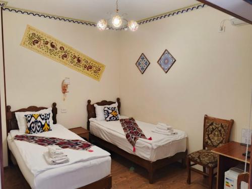 Postel nebo postele na pokoji v ubytování ESHONI PIR Boutique