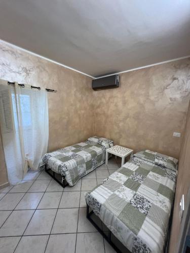 Postel nebo postele na pokoji v ubytování Agherè