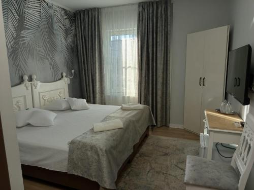 Postel nebo postele na pokoji v ubytování Hotel Mantra