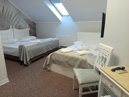 Postel nebo postele na pokoji v ubytování Hotel Mantra