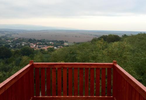 a wooden deck with a view of a valley at Villa Quality Wellness in Dozmat