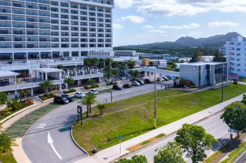 an aerial view of a city with buildings at 本部町 最大12名宿泊可 無料駐車場2台付き 家族 グループに最適 Terrace Motobu in Motobu