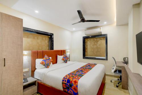 Ένα ή περισσότερα κρεβάτια σε δωμάτιο στο FabHotel Mio