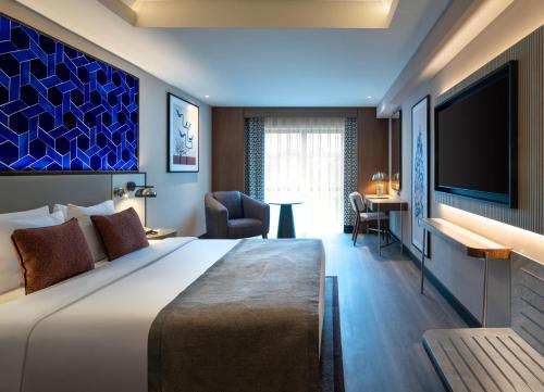 Ένα ή περισσότερα κρεβάτια σε δωμάτιο στο Mercure Istanbul Altunizade