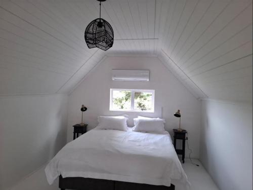 En eller flere senge i et værelse på Town House