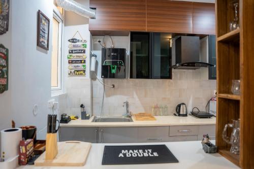 a kitchen with a sink and a counter top at Blissful Escape Dehradun in Dehradun