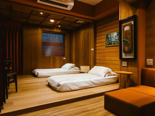 Postel nebo postele na pokoji v ubytování 輕塵別院Serenegray B&B