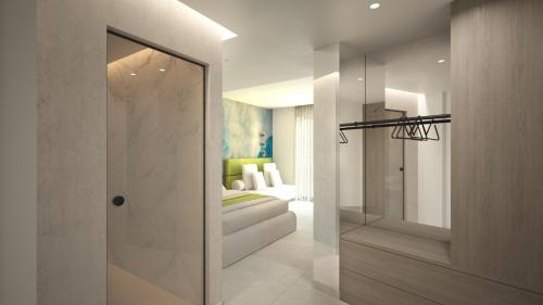 a room with a door leading to a bedroom at Leonidas Hotel & Apartments in Rethymno Town