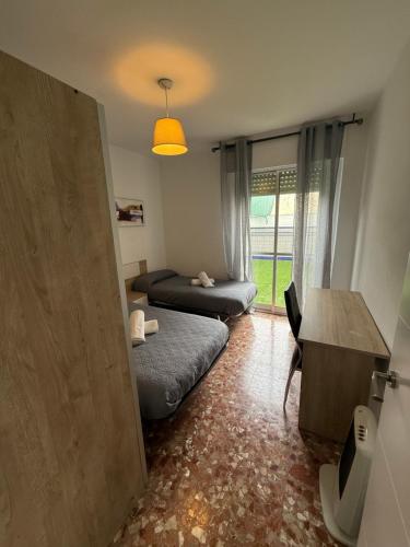 Ένα ή περισσότερα κρεβάτια σε δωμάτιο στο AVENIDA CENTRO 2 Dormitorios PONDOS