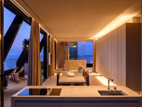 a living room with a couch and a table at Victoria Palace Hotel in Cattolica