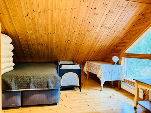 Ένα ή περισσότερα κρεβάτια σε δωμάτιο στο Whispering Pines