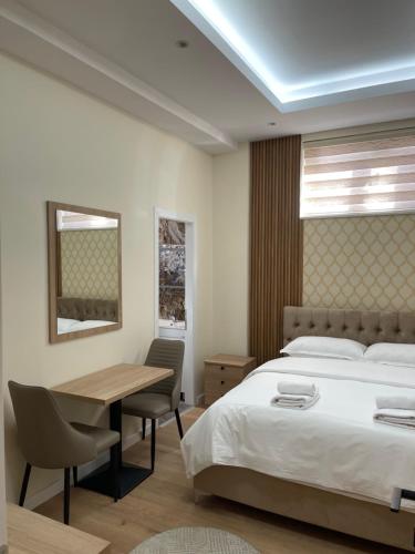 Ένα ή περισσότερα κρεβάτια σε δωμάτιο στο Vila Mete Apartment's