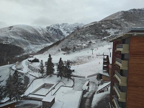 a snow covered mountain with a ski slope in the distance at Appartement Peyragudes les Agudes in Gouaux-de-Larboust