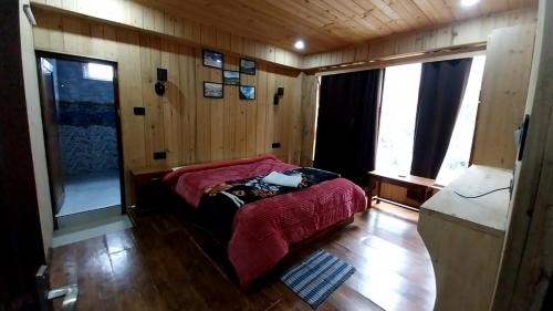 Ένα ή περισσότερα κρεβάτια σε δωμάτιο στο Namgyal Home Stay