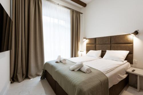 Ένα ή περισσότερα κρεβάτια σε δωμάτιο στο Willa Zieleniec, Sun & Snow