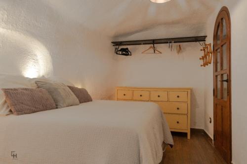 Postel nebo postele na pokoji v ubytování Cueva la estrella