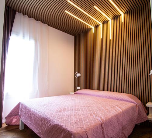 Postel nebo postele na pokoji v ubytování Villini Florence